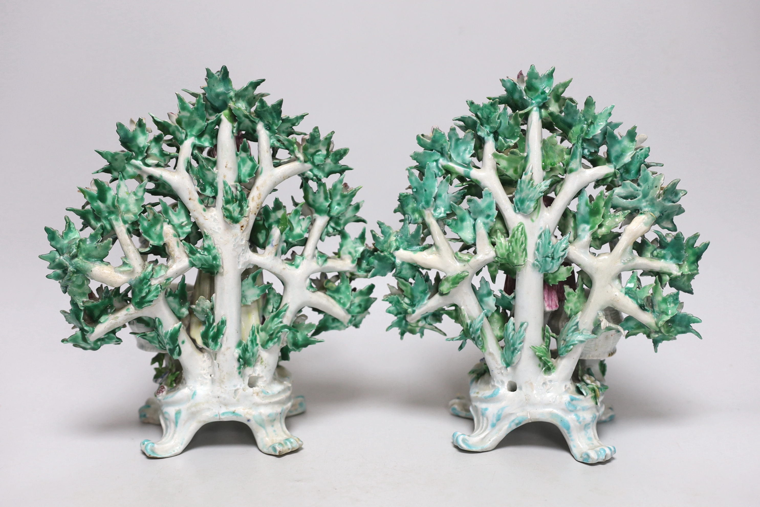 A pair of 18th century Bow figural sweetmeats, c.1765, each with marks to the base, 23cm high